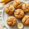 Freshly baked Banana Bread Mini Muffins displayed on a kitchen counter.