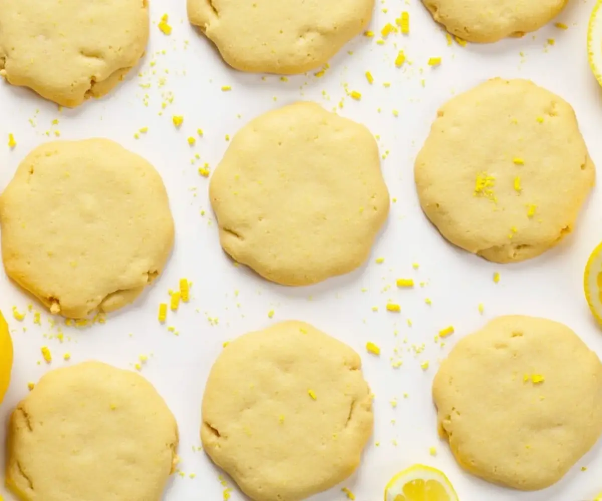 Lemon shortbread recipe ingredients: Butter, flour, sugar, lemon zest, and fresh lemon slices, ready to be mixed into the perfect dough.